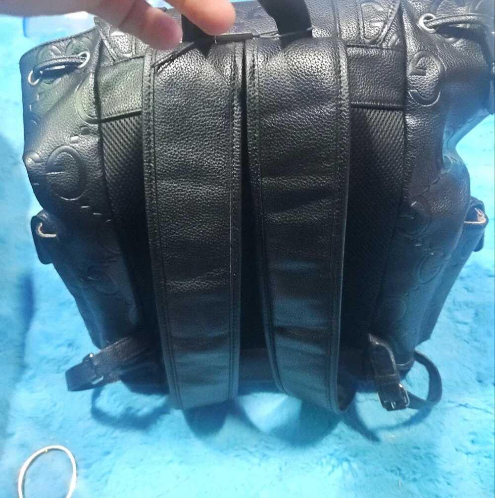 Gucci Black Embossed GG Leather Drawstring Backpack